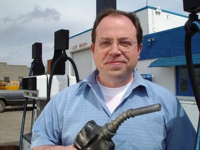Brent Butt holds a gas nozzle on the set of the CTV comedy series Corner Gas in Roleau, Sask, in this undated handout photo. (CP PICTURE ARCHIVE/HO - CTV)