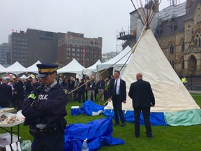 RCMP guard the ceremonial teepee Friday morning as Prime Minister Justin Trudeau and Sophie Grégoire-Trudeau visit.