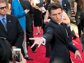 Tom Holland poses for a photo as he arrives at the Los Angeles premiere of "Spider-Man: Homecoming" at the TCL Chinese Theatre on Wednesday, June 28, 2017. (Photo by Paula Munoz/Invision/AP)