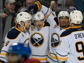 Marcus Foligno (82) celebrates a goal with teammates in Buffalo. The Canadian Press