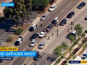 This image from video provided by KABC-TV shows the scene where a Los Angeles police officer was shot following the pursuit of a homicide suspect ending in El Segundo, Calif., on the border of neighboring Hawthorne, Thursday, June 29, 2017.  (KABC-TV via AP)