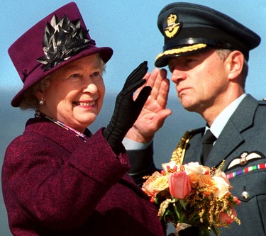 Queen Elizabeth II waves goodbye at the Canadian Reception Centre after a 11-day tour of Canada, Oct. 14, 2002.