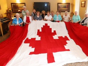 The Knotty Knitters working away at the Canadian Flag.  JEAN LEVAC