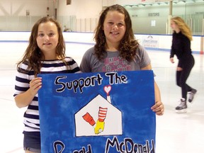 Westfield Public School students Katie Behman, left, and Myra Craig organized a fundraiser for Ronald McDonald House in London at the Tillsonburg Community Centre's Colin Campbell Arena on Saturday, which raised $500. (HEATHER RIVERS/Postmedia Network)