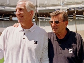 In this Aug. 6, 1999, file photo, Penn State University head football coach Joe Paterno, right, poses with his defensive coordinator Jerry Sandusky, left, during a Penn State Media Day event in State College, Pa. (AP Photo/Paul Vathis, File)