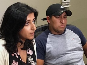 Lawyer Saira Hussain, left, and her client, Pedro Figueroa-Zarceno, answer questions about a settlement with the city of San Francisco on Thursday in San Francisco. (AP PHOTO)