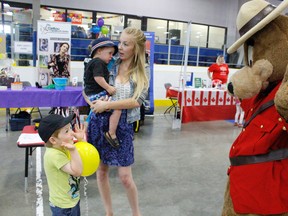 RCMP Safety Bear plays peek-a-boo with little Connor Knoblauch during Dave Barr's 4th Annual FREE Kids Fair on Thursday June 29, 2017 in Grande Prairie, Alta. Connor along with mom Hannah Davies and brother Ozrik Karr took in the day's event at Dave Barr Community Centre. Under the bear suit was Constable Krystle Hunt. 
Nicole Auger/Grande Prairie Daily Herald-Tribune/Postmedia Network