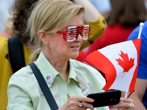 Shirley Little of London came with patriotic glasses and flag to opening day of SesquiFest at the Covent Garden Market. (MORRIS LAMONT, The London Free Press)