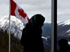 Syrian refugee Lina Hejazi, 32, and her son Khaled Hussain, 6, in Banff, Alta., on March 23, 2017, during a new program being offered by Brewster Travel Canada where they take new refugees to see the Rockies in a first class experience. (Leah Hennel/Postmedia Network)