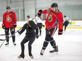 Figure skating coach Shelley Kettles instructs Nick Paul on better feet positions as the Ottawa Senators continue with their development camp for prospects at the Bell Sensplex. (Wayne Cuddington/ Postmedia Network)