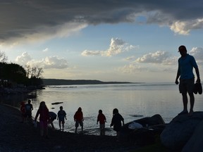 Young stone-skippers enjoy the calm after an early evening storm at Meaford?s Fred Raper?s Park, along Georgian Bay. (BARBARA TAYLOR/THE  London Free Press)