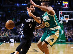 In this March 15, 2017, file photo, Minnesota Timberwolves' Ricky Rubio (9) tries to drive past Boston Celtics' Avery Bradley (0) during the second half of an NBA basketball game in Boston. The Timberwolves have reached an agreement to Rubio to the Utah Jazz to clear salary cap space for a big run in free agency. A person with direct knowledge of the deal tells The Associated Press the two sides agreed to the move on Friday, June 30, 2017, hours before free agency opened. (AP Photo/Charles Krupa, File)