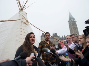 Candace Day Neveau speaks to reporters after Prime Minister Justin Trudeau met with people in a teepee on Parliament Hill on Friday.