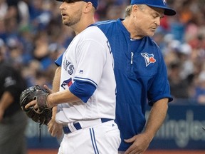 Manager John Gibbons pulls Blue Jays starting pitcher Marco Estrada out of the game during the fifth inning against the Red Sox in Toronto on Friday, June 30, 2017. (Fred Thornhill/The Canadian Press)