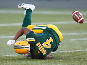 Edmonton Eskimos' Adarius Bowman (4) misses the catch during first half CFL action against the Montreal Alouettes, in Edmonton on Friday, June 30, 2017.