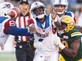 Montreal Alouettes quarterback Darian Durant (4) is hit by Edmonton Eskimos' Kwaku Boateng (93) during first half CFL action in Edmonton on Friday, June 30, 2017.