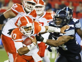 QB Jonathon Jennings of the BC Lions and Victor Butler of the Toronto Argonauts during CFL action in Toronto, Ont. on Friday June 30, 2017. The Toronto Argonauts hosted the B.C. Lions.(Veronica Henri/Postmedia Network)