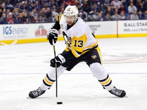 In this Dec. 22, 2016, file photo, Pittsburgh Penguins' Nick Bonino plays against the Columbus Blue Jackets during an NHL hockey game in Columbus, Ohio. The Western Conference-champion Nashville Predators took care of an area of concern, signing center Nick Bonino away from the Stanley Cup champion Penguins with a $16.4 million, four-year contract on Saturday, July 1, 2017. (AP Photo/Jay LaPrete, File)