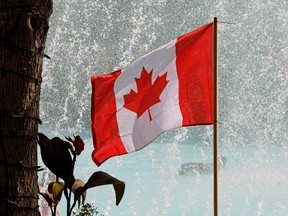 A Canada flag flies in the breeze outside Edmonton City Hall on July 1, 2017. (PHOTO BY LARRY WONG/POSTMEDIA)