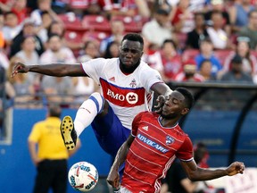 Toronto FC’s Jozy Altidore attempts to control a pass on an attack as FC Dallas defender Maynor Figueroa disrupts the play during the second half in Frisco, Texas, last night. (AP)