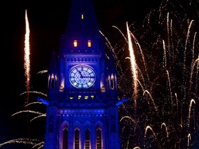 Fireworks light up the sky behind the Peace Tower in Ottawa on Saturday night.