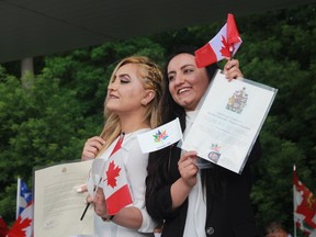 Sisters Jiyan and Dilan Dary became Canadian citizens on Canada Day at Harris Park. Before then, they did not have citizenship to any country. (Shalu Mehta/The London Free Press)