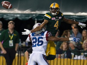 Montreal Alouettes Tyree Hollins (26) interfere with Edmonton Eskimos Adarius Bowman (4) during a convert attempt on Friday June 30, 2017, in Edmonton.