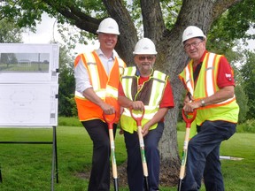 Jeff Keyes (left), of Sofina Foods Inc.; Bill French, Mitchell Lions Club president; and Walter McKenzie, West Perth mayor, participate in the ceremonial sod turning on Saturday, July 1 for the municipal legacy project in Lions Park. Each organization donated $10,000 to the project, which hopefully will be built later this year to mark West Perth’s participation in Canada’s Sesquicentennial. ANDY BADER/MITCHELL ADVOCATE
