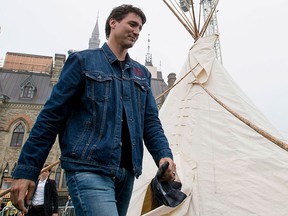 Prime Minister Justin Trudeau leaves a teepee on Parliament Hill in Ottawa on Friday, June 30, 2017. THE CANADIAN PRESS/Justin Tang