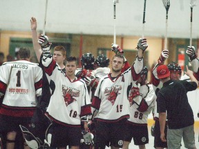 Wallaceburg Red Devils players Tyler Brown and Brendan Johnston salute the crowd, following Game four of their playoff series against Windsor at Wallaceburg Memorial Arena on Saturday, July 1.