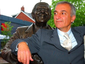 Lenny Lombardi relaxes beside a monument to his father, John Lombardi. (SUN FILES)