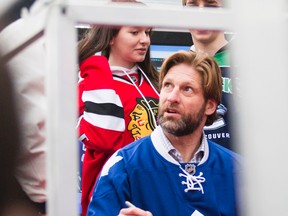 Former NHLer Shayne Corson signs autographs in St. Catharines, Ont., during Rogers Hometown Hockey on Dec. 14, 2014. (Bob Tymczyszyn/St. Catharines Standard)