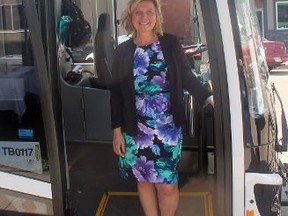 Whitecourt Mayor Maryann Chichak stands at the entrance of one of the town's buses on May 29. Chichak and the rest of council made several changes to the transit system on June 26 (Jeremy Appel | Whitecourt Star).