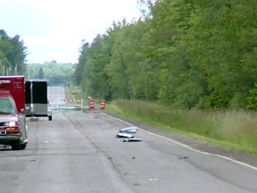 In this image made from a video provided by WAOW debris covers the road on Sunday, July, 2, 2017, near Phillips, Wis., after several people were killed in an airplane crash on Saturday. The Price County Sheriff's Office says the plane had left from Chicago and was heading to Winnipeg, Man., on a fishing trip. (Courtesy WAOW via AP)