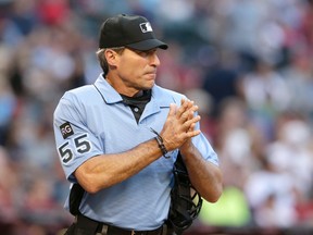 In this April 8, 2017 file photo, MLB umpire Angel Hernandez is seen in the first inning during a baseball game between the Arizona Diamondbacks and the Cleveland Indians, in Phoenix. (AP Photo/Rick Scuteri, File)