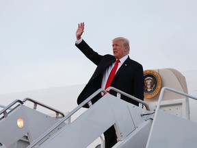 President Donald Trump waves as he arrives on Air Force One Monday, July 3, 2017, at Andrews Air Force Base, Md., en route to Washington. (AP Photo/Carolyn Kaster)