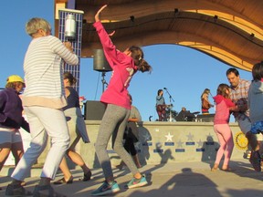 Dancers filled the space at the front of the Rotary Community Stage Monday June 3, 2017 at the beach in Grand Bend, Ont., when the folk trio Trent Severn offered a free copy of its latest CD as the prize for a dance contest. Monday was the opening night for this year's Grand Bend Summer Sunset Sounds free weekly concert series at the beach. (Paul Morden/Sarnia Observer/Postmedia Network)
