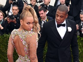 This file photo taken on May 4, 2015 shows Beyonce and Jay-Z arriving at the Metropolitan Museum of Art's Costume Institute Gala benefit in honor of the museums latest exhibit China: Through the Looking Glass in New York. (TIMOTHY A. CLARY/AFP/Getty Images)