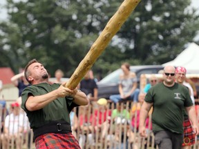 Dale Andrew, left, lets go the caber as part of the Ontario Heavy Events Championships in Embro, Ont. on Saturday July 1, 2017 at the 80th annual Embro Highland Games. The event had more than 1,000 spectators come out. (Greg Colgan/Woodstock Sentinel-Review/Postmedia Network)