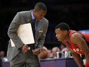 In this Jan. 1, 2017, file photo, Toronto Raptors coach Dwane Casey talks with guard Kyle Lowry during the team's NBA basketball game against the Los Angeles Lakers in Los Angeles. (AP Photo/Kelvin Kuo, File)