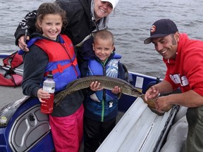 Five-year-old William Lachapelle, along his dad Ray Lachapelle, mom Jaimie Lachapelle and nine-year-old sister Olivia, shows off his prize-winning northern pike from the Chelmsford Fish and Game Association's Family Fishing Tournament held June 25 on Vermillion Lake. Supplied photo