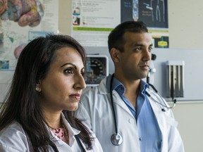 Dr. Kulvinder Gill (left) and Dr. Mark D'Souza pose for a photo in a medical office in Brampton. (ERNEST DOROSZUK , Toronto Sun)