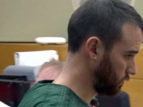 In this image made from a video provided by Q13 News, Cameron Espitia, who is accused of fatally shooting his wife Jennifer Espitia, makes an appearance in a King County courtroom in Seattle, Monday, July 3, 2017. (Bill Bushmaker/Q13 News via AP)