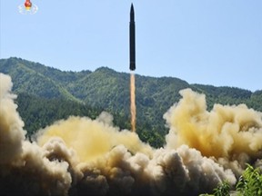 This image made from video of a news bulletin aired by North Korea's KRT on Tuesday, July 4, 2017, shows what was said to be the launch of a Hwasong-14 intercontinental ballistic missile in North Korea's northwest. Independent journalists were not given access to cover the event depicted in this photo. (KRT via AP Video)