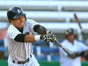 Carlos Arteaga of the London Majors reaches and hits a line out to first base during their makeup game against the Brantford Red Sox at Labatt Park on Tuesday July 4, 2017. (MIKE HENSEN, The London Free Press)