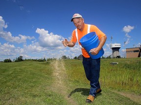 Mark Wood of Corescape Landscaping Ltd. seeds one of the four fields damaged at John Machin Soccer Park in Kingston on Tuesday July 4 2017. Ian MacAlpine /The Whig-Standard/Postmedia Network
