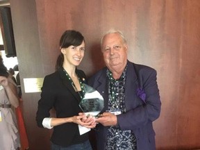 SUBMITTED PHOTO
Rebecca Lamb, destination development and marketing co-ordinator for Prince Edward County, is pictured receiving the award for the best photograph at the 2017 LGBT Tourism Marketing from Colin Sines, executive director of Travel Gay Canada.