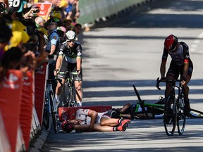 Germany's John Degenkolb (L) and Great Britain's Mark Cavendish (2ndL) lie on the ground after falling near the finish line at the end of the 207,5 km fourth stage of the 104th edition of the Tour de France cycling race on July 4, 2017 between Mondorf-les-Bains and Vittel. (JEFF PACHOUD/AFP/Getty Images)