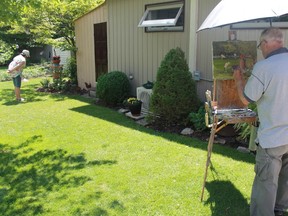 Landscape painter J. Allison Robichaud puts the finishing touches on a portrait featuring his wife Margot Snow in his backyard during Communities in Bloom Sarnia's annual Garden Tour on June 24.
CARL HNATYSHYN/SARNIA THIS WEEK