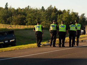 Police investigate the scene of a crash on the off ramp of the Anthony Henday Drive going onto Whitemud Drive on Monday July 3, 2017, in Edmonton.